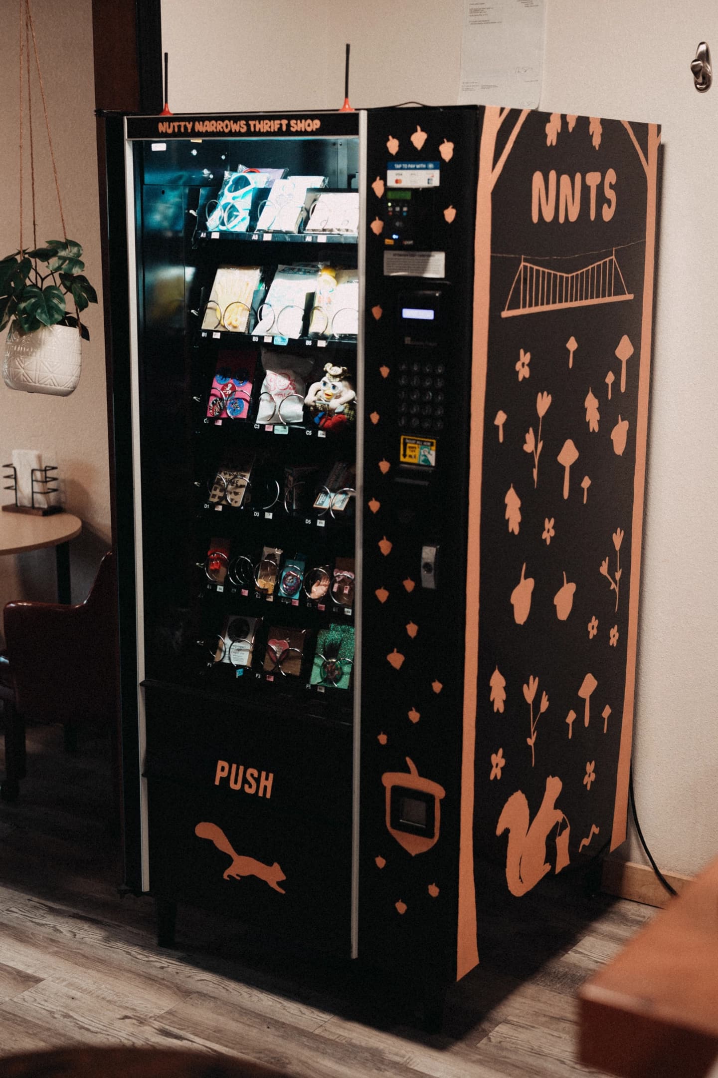 Nutty Narrows Thrift Shop vending machine with squirrel logo, stocked with art and trinkets, Longview, WA